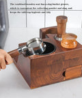 Slick Wooden Coffee Knock Box With A Solid Built In Tamping Station And Smart Hidden Compartment For Zero Hassle Daily Espresso Cleanup On Your Kitchen Counter, showing integrated wooden seat and portafilter.