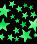 200 Pcs Glow In The Dark Stars With Moon 3D Wall Stickers Set For Kids Room Decor And Night Light Ceiling Space Theme Lit Night Sky Decals With Adhesive Putty Non Toxic Plastic shown illuminated.