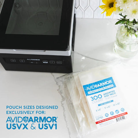 Go To Pro Grade Vacuum Sealer Bags Set 6x8, 8x10, 10x10 inches, 300 pack BPA free shown with sealing machine on countertop