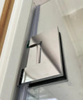 Close-up of Hella Sturdy Brass Shower Door Hinge showcasing chrome finish and robust design for bathroom glass panels.