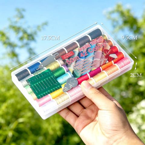 Person holding Rainbow Sewing Thread Kit With 42 Assorted Colors And White And Black, Handy Polyester Spool Set Includes 9 Needles