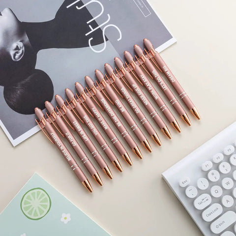 Set Of 12 Rose Gold Motivational Quote Pens With Screen Touch Stylus Snarky Office Scripture Ballpoint Pens In Black Ink Cheerful Yet Pro Level Writing Tools For Work Study Creativity And Daily Encouragement neatly arranged on desk