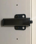 Super Slick Push To Open Cabinet Latches With Strong Magnet Set Of 3 Silver Touch Release Handles mounted on cabinet door.