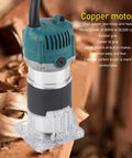 Close-up of Built Tough 800W Electric Palm Router With Clear Base And Soft Touch Rubber Grip Smooth As Butter 30000 Rpm, showing copper motor.