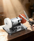 No Nonsense Mini Bench Grinder Rockin A Beefy 96W Copper Motor With Seven Smooth Variable Speeds From 3000 To 6000 Rpm Plus Easy Forward Reverse Controls For Quick Sharpening And Precision Grinding Work on workbench with scissors.