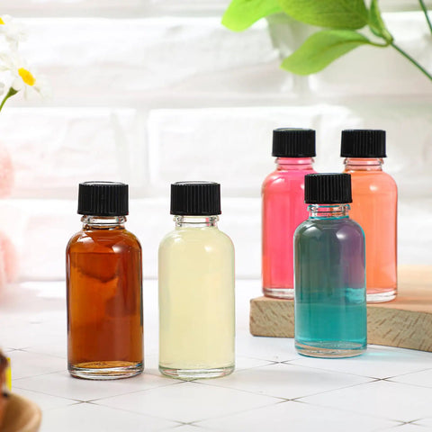 Clear Boston Round Glass Bottles With Black Screw Cap, One Oz Capacity, Complete Kit With Seventy Two Self Stick Labels, Four Precision Funnels, And Fine Liner For Slick DIY Blending, No Fuss Organization, And Totally Solid Storage Set in varying colors.