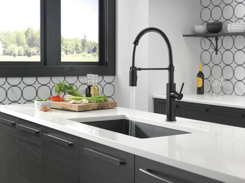 Heavy Duty Slick Finish Kitchen Faucet With Smooth Pull Down Spray Single Handle Matte Black Build in modern kitchen with vegetables.