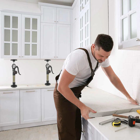 Two MANQO cabinet jacks on kitchen counter; adjustable 12.6–23.6 in, 156 lb capacity, 2-piece set.
