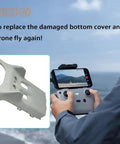Bottom Shell Replacement For DJI Mini 3 Drone Body Frame Cover Beefs Up Your Rig shown with controller and ocean backdrop