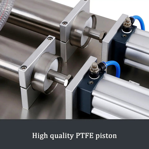 Heavy Duty Double Head Pneumatic Bottle Filler Built Tough Handles One To Forty Bottles Per Minute Stainless Steel Liquid Filling Machine close-up of steel PTFE pistons.