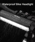 Ultra Bright 1800 Lumen Bike Light With Five Modes, USB Rechargeable Front Headlight mounted on bike, wet from rain.