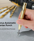 Hand holding automatic center punch for Titanium Coated Drill Bit Set, 99-Piece HSS Kit With 135 Degree Tips And A Heavy Duty Storage Case