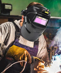Welder using Auto Darkening Welding Hood With True Color Viewing System And Large Window For On Site Metalworking
