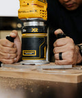 TrimFit Pro Dual Grip Router Base Plate for DeWalt DWP611 with dual handles in use on wood