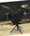 Heavy Duty Adjustable Height Tripod Snare Drum Rack Stand With Slick Black Alloy Finish For Rock Solid Practice And Tour Ready Drummer Gear Organization in a studio setting.