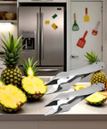 Stainless Steel Pineapple Eye Remover And Core Cutter With V Shaped Tip in kitchen with fresh pineapples, ideal for home cooks
