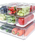10 Pack Fridge Organizer Bins With Lids, Stackable Refrigerator Storage Containers holding assorted fruits and vegetables.