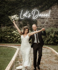 Couple dancing under Dimmer Neon Sign For Wall Decor 21.3 By 17.3 Inch LED 3D Light In Cold White Perfect For Bedroom Bar Wedding Or Party Vibe Great Gift For Lovers And Friends Brighten Up Your Space With A Dope Neon Look.