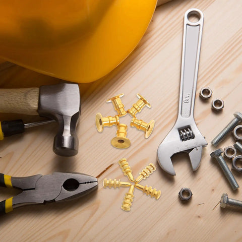 Leaf Connector Kit Set For Furniture And Wardrobe Shelves, zinc alloy dowel pins with copper sleeves surrounded by tools on a wooden surface.