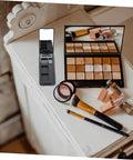 Dope New Compact Travel Makeup Palette With Mirror, Four Pack Empty Eyeshadow Containers For Portable Cosmetic Refills And Fly On The Go Beauty Organizers on a wooden surface.