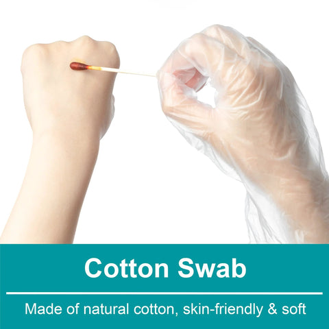Cotton swab with white stick held by gloved hand; close-up view.