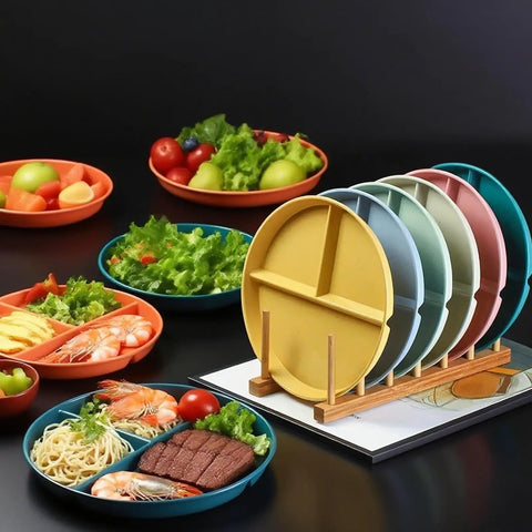Eight Pack 9 Inch Divided Plates With Spoons Set Colorful Stackable Portion Control Dinner Plates on a rack, with food