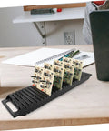Anti Static Bar Rack With 25 Slot PCB Tray ESD Safe Circulation Shelf on a desk holding circuit boards.