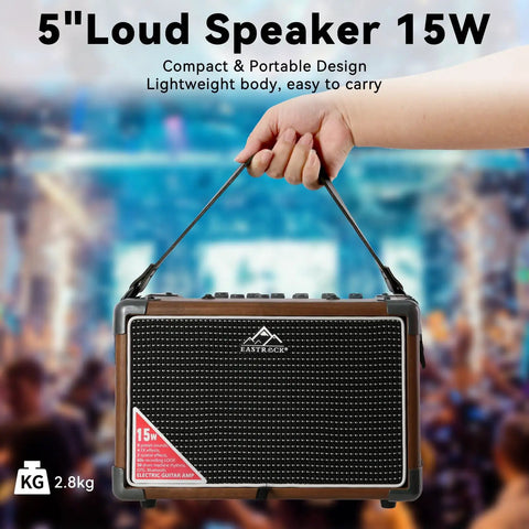Person holding a Portable 15W Guitar Amp With Bluetooth Built In Looper And Drum Machine 8 Voices FX Effects Aux OTG Compact Practice Amp