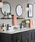 Modern bathroom with Genta LX Matte Black Shower Set, dual sinks with black faucets, round mirrors, and sleek vanity.