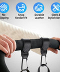 Hands attaching 4 Pack Premium Non Slip Stroller Hooks With Adjustable Carabiner Clips to stroller handle