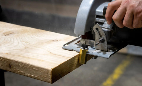Beefy Brass Stair Gauge Set For Framing And Carpentry Squares 2-Piece in use for precise right-angle cuts on wood.