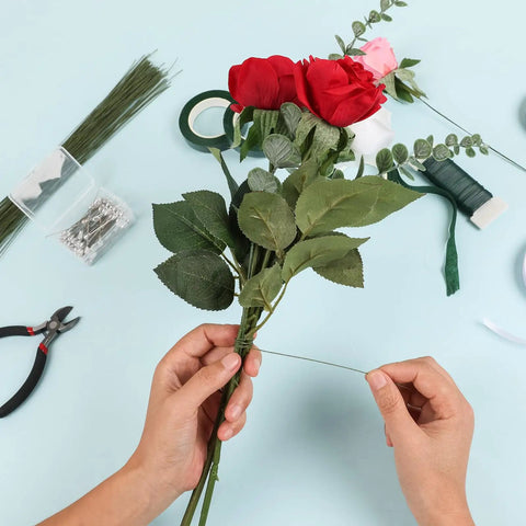 Person arranging flowers using DIY Floral Arrangement Kit With Green Floral Tape And Wire For Boutonniere And Bouquet
