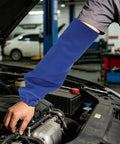 Heavy Duty Flame Resistant Welding Sleeves 21 Inch Blue Cotton Arm Guards with Stretch Bands worn while working on a car engine.