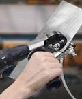 Close-up of CZS sheet metal cutter drill attachment mounted on a power drill cutting a metal sheet