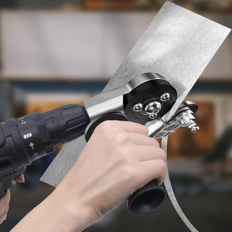 Close-up of CZS sheet metal cutter drill attachment mounted on a power drill cutting a metal sheet