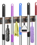 Rustic Wood Broom Holder Wall Mount With 5 Racks And 4 Hooks for organizing brooms, mops, and cleaning tools.