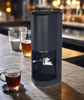 Fully Automatic Espresso Tamper Machine With Slick Digital Controls And Adjustable Pressure For Dead On Accurate Extraction Every Single Time Perfect For Home Baristas Using Standard 58Mm Portafilters on a wooden bar with espresso cup