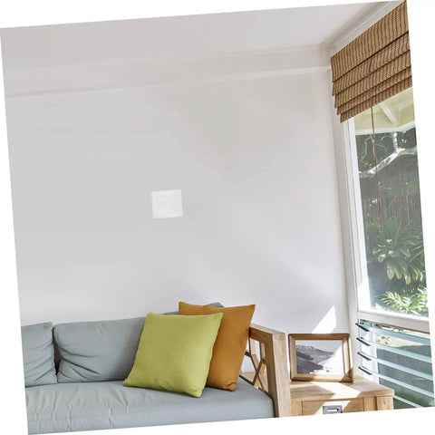 Living room wall with a 12 Piece Self Adhesive Wall Patch Kit With Sturdy Mesh Drywall Patches For Quick Hole Repair applied above a sofa