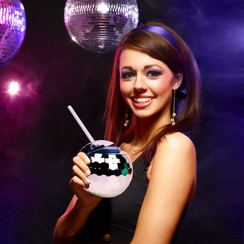 Woman holding Disco Ball Cups 4-Pack Reusable Tumblers With Straws For Party Nights, Perfect Drinkware For New Year’s Eve.