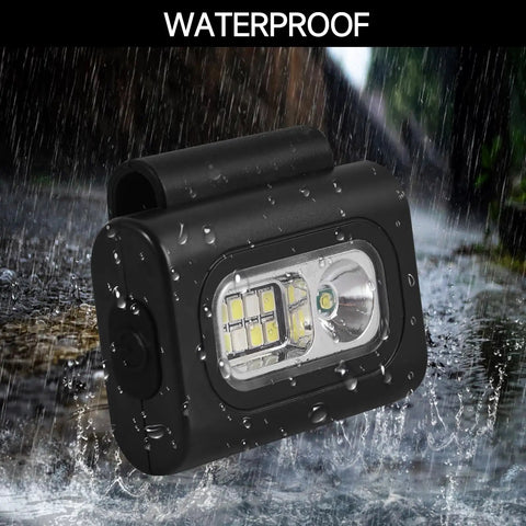 Clip On Running Light Two Pack Magnetic Clip On Light For Runners With Six Lighting Modes Rechargeable Reflective Night Running Gear For Walking Hiking Camping Black in rain showing waterproof feature.