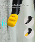 Night Glow Alien Brake Lever Cover 2 Pack Silicone Protector Sleeve For Bikes And Shifters Scratch Resistant And Waterproof Bicycle Handle Guard For Kids And Adults with yellow design on bike lever.