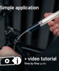Person using Bike Brake Bleed Kit For Magura Hydraulic Disc Brakes With 100ml Mineral Oil, Step By Step Instructions And Video Manual