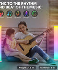 2 Pack Corner LED Floor Lamp With App Control RGB Color Changing Lights Music Sync Dimmable Brightness beside people playing guitar