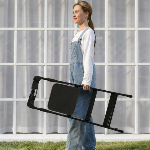 Lightweight Aluminum Three Step Folding Ladder With Big Wide 13.8 By 13 Inch Platform And Handy Tool Tray For Home Projects, ANSI A14.2 Certified, Sturdy Portable Stepladder For Indoor Fixes And DIY Tasks. Woman carrying a folded black aluminum 3-step ladder with wide platform.