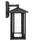 Side view of seeded glass outdoor wall light with dusk to dawn sensor, 1000 lumens of warm 3000K glow, 15.5 inch tall porch lantern.