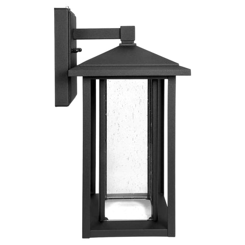 Side view of seeded glass outdoor wall light with dusk to dawn sensor, 1000 lumens of warm 3000K glow, 15.5 inch tall porch lantern.