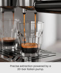 Close-up of espresso extraction from Quick Heat 20 Bar Espresso Machine With Integrated Milk Frother For Silky Lattes And Cappuccinos Boasting Rapid Boiler And Spacious Removable Tank Designed For Reliable Daily Grind Sessions And Consistent Home Barista Pulls Stainless Finish.