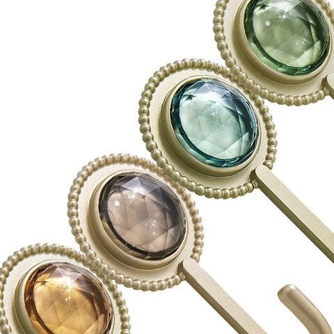 Slick Four Pack Adhesive Wall Hooks For Hanging Towels And Robes With Knockout Grip No Drilling Required Super Quick Mount For Bathroom Kitchen Or Entryway Storage, featuring decorative orb designs.