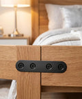 Built Tough Black Stainless Steel Mending Plates With Full Screw Kit on wooden furniture joining corners with black screws.