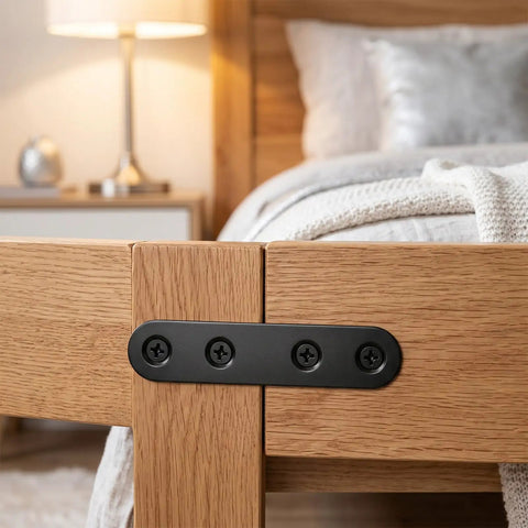Built Tough Black Stainless Steel Mending Plates With Full Screw Kit on wooden furniture joining corners with black screws.